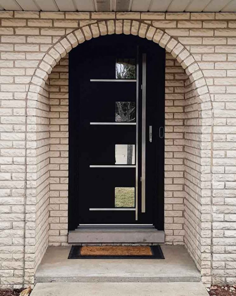 Main door of a house in an arched doorway