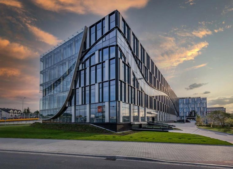 A modern building designed with glass all over for the windows and doors